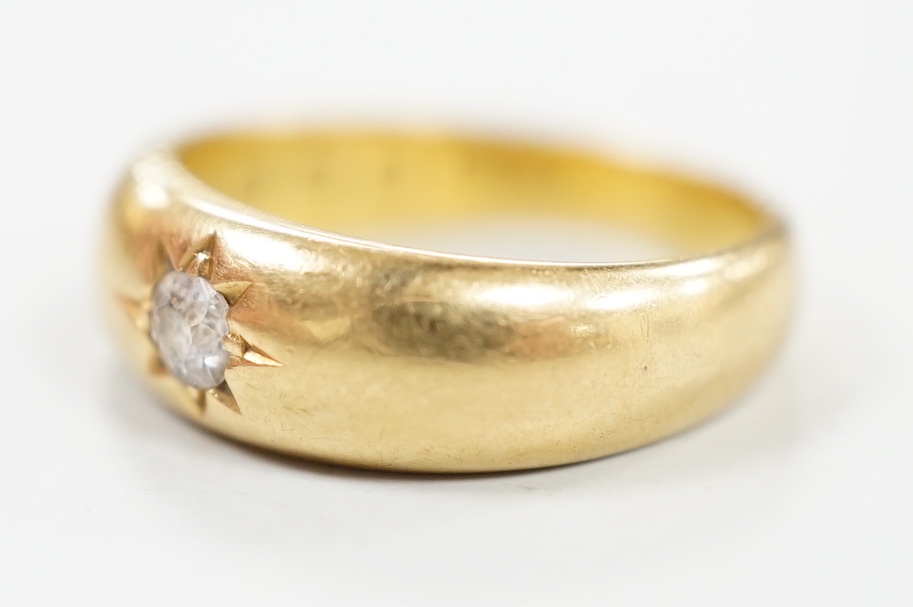 A late Victorian 18ct gold and gypsy set solitaire diamond ring, size J, gross weight 2.8 grams.